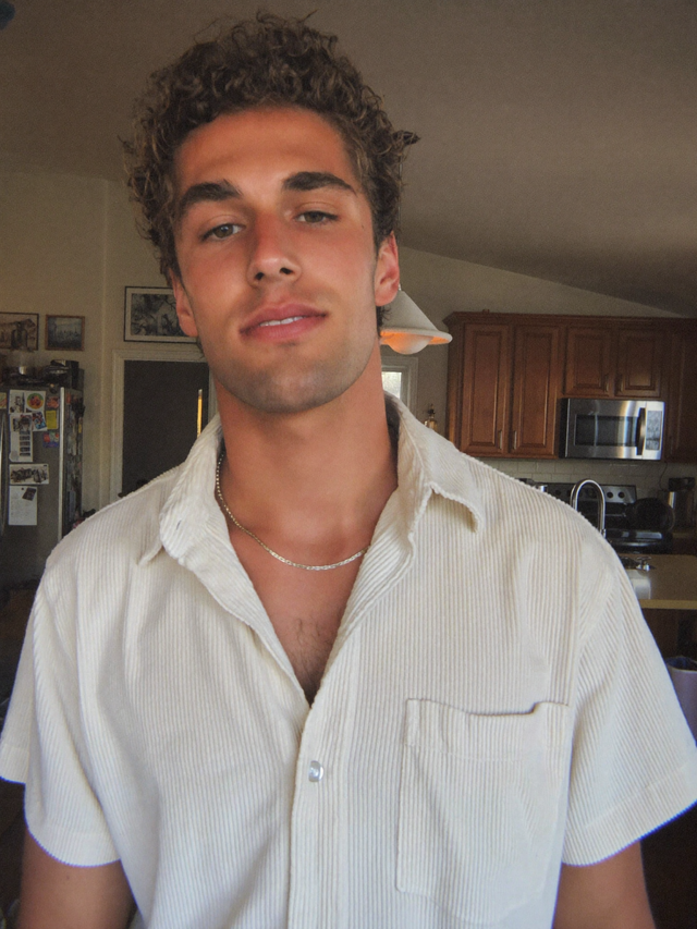 Daniel M. wearing The Ambrose Knit Polo