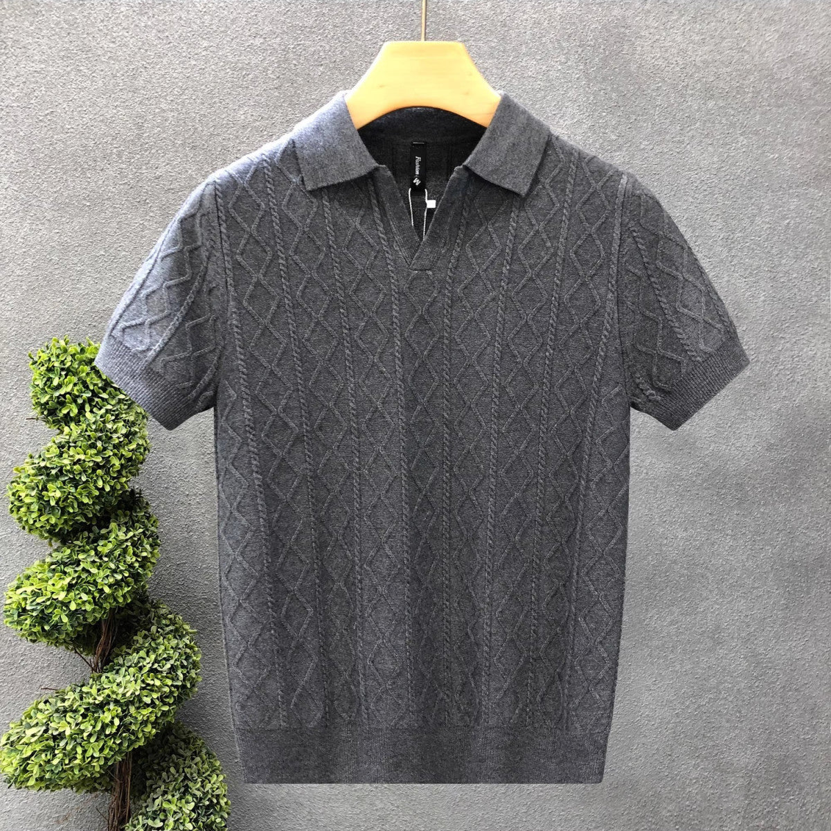 The Whitfield Polo - a richly textured cable-knit polo with a zip placket V-neck