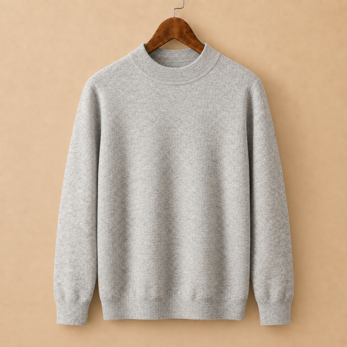 The Alderley Wool Sweater in Grey on a hanger
