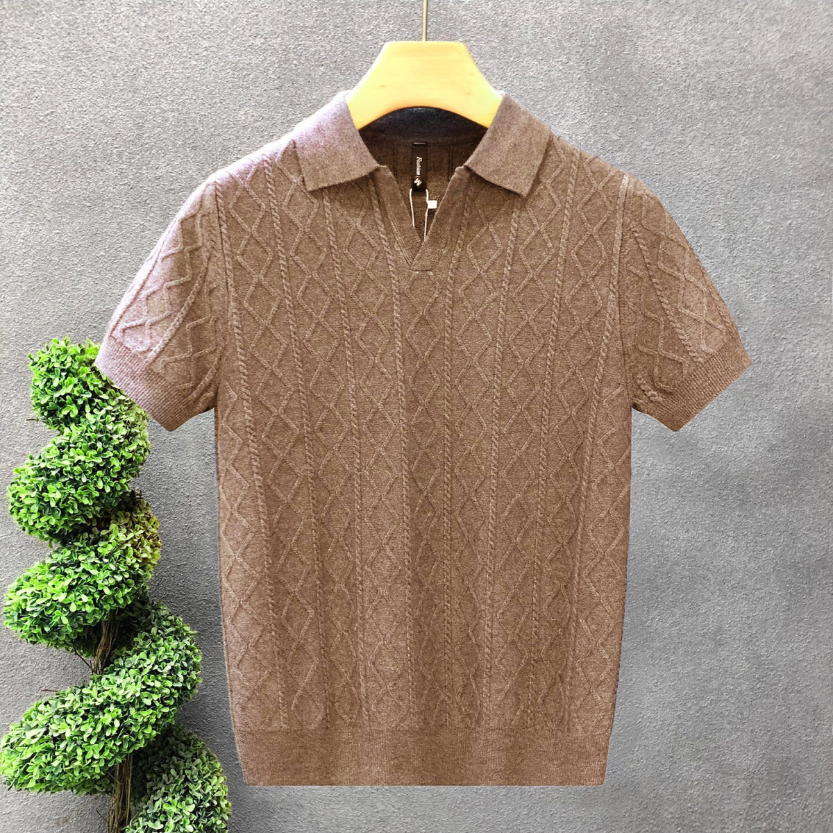 The Whitfield Polo - a richly textured cable-knit polo with a zip placket V-neck
