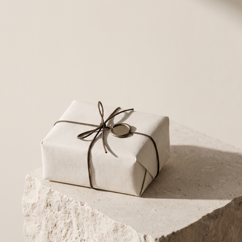 Shipment Protection — a parcel wrapped in bone paper, tied with cord and closed with a bronze wax seal